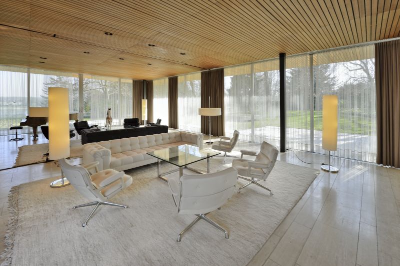 Bright reception room with elegant brown and white seating furniture